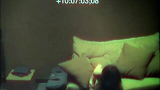 Sexy babe relaxes on sofa with hidden cam view