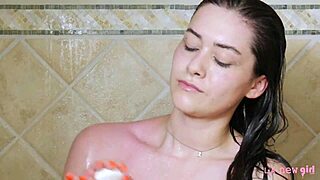 sexy brunette model freshens up with a steamy shower session