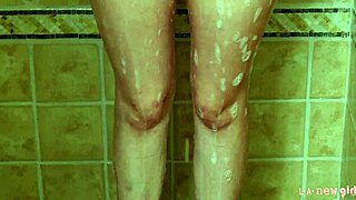 sexy brunette model freshens up with a steamy shower session