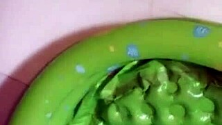 Asian beauty exposed by the moonlight while taking a shower