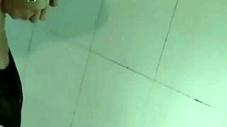 Asian beauty exposed by the moonlight while taking a shower