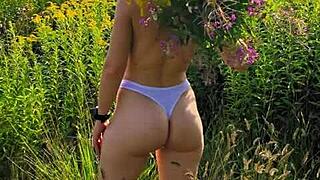 girl with small tits walks in nature wearing short shorts and t-shirt, anna mole