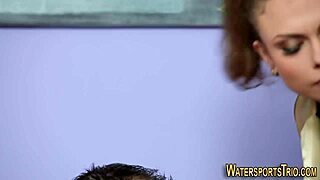 Face spunked slut gets pissed on in golden shower threesome