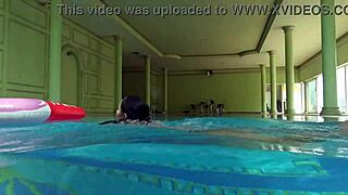 Kittina Ivory strips in the cool water of the pool