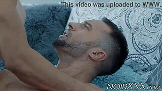 In this interracial scene, muscular bodybuilders engage in rimming and anal activities together