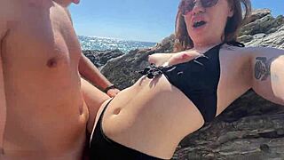 Hot brunette fucks a stranger on a public beach