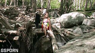 Sexy natural 18-year-old girl touches her hairy pussy deep in the forest for intense pleasure.