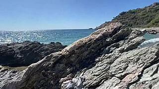 Hot brunette fucks a stranger on a public beach