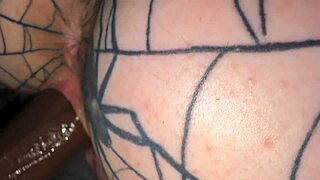 Olivia Gardens slowly rides the big black cock, her bare feet dangling in the air.