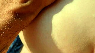 Stranger applies sunscreen on nudist beach!