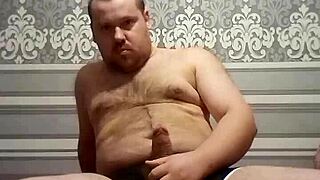 Look, this fat gay man strokes his thick cock with skill