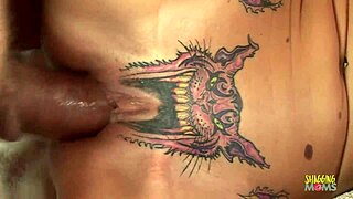 skinny blonde with pussy tattoo takes creampie on red couch. she rides hard in cowgirl style.