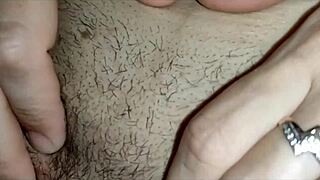 Stretching his wife's ass gently with fingers