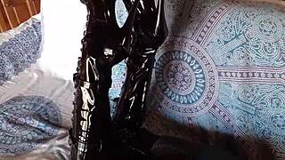 total black outfit with fishnets pantyhose and over the knee boots