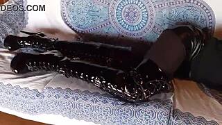 total black outfit with fishnets pantyhose and over the knee boots