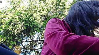 nicoletta is smoking in the public garden and flashing her big tits by pulling them out