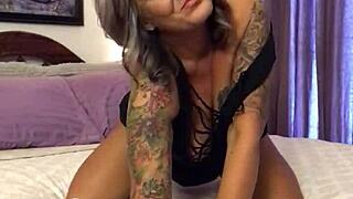 blonde tattooed milf seduces on cam with glass dildo until she squirts hard