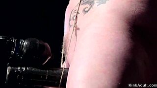 Anal hooked slut endures pain in tight device bondage.