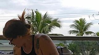 girl flashes her ass on the balcony in skirt