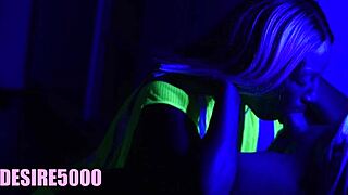 blonde couple in garden under black light