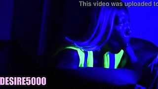 blonde couple in garden under black light