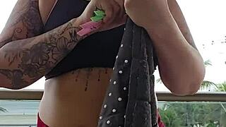 girl flashes her ass on the balcony in skirt