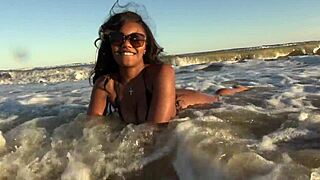 ebony woman getting naked on beach