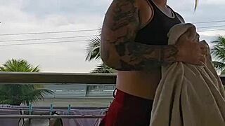 girl flashes her ass on the balcony in skirt