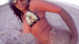 ebony woman getting naked on beach