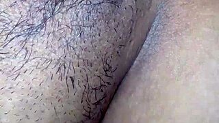 a young woman poses on all fours in a casual setting, showcasing her figure naturally