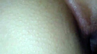 a young woman poses on all fours in a casual setting, showcasing her figure naturally