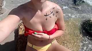 damn, watching this hot blonde play with her pussy on the beach is unreal