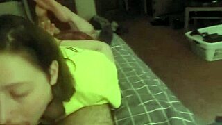 redhead slut deepthroats while lying on her belly