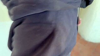 Neighbor's wife gives a homemade blowjob in the laundry room, ending with cum in her mouth.