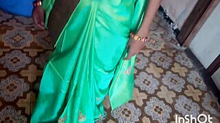 Village bhabhi Shivani stuns in green saree at a homemade gathering.