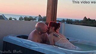 redhead couple kisses in hot tub bath