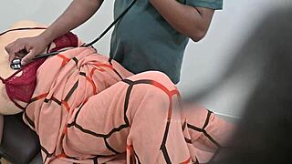 Indian Doctor Checking Lady Patient In Clinic