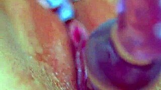 Girl's puffy pussy loves that glass dildo