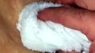 Blonde milf spreads her shaved wet pussy invitingly.