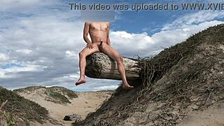 An athletic woman poses nude on the beach, teasing her cock before cumming in the plaza.