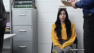 In the office, a brunette babe gives a blowjob after a strip search, spied on secretly