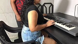 Curvy young woman in tight skirt in hot keyboard lessons