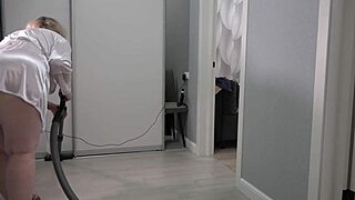 A home camera captures the mature housewife's thick ass and saggy tits under short robe