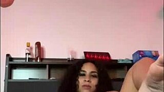 Horny Curly Latina Fucks Pussy with Dildo While Stretching on Bed