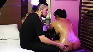 Nicoly Mattos moans intensely while squirting all over the bed during oiled anal fingering.