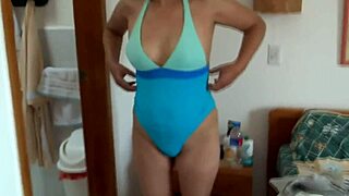 beautiful mature latina shows off in bikini on beach