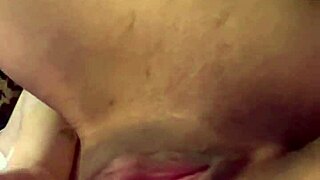 Tattooed woman teases her wet puffy pussy with toys.