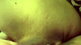 Tattooed woman teases her wet puffy pussy with toys.