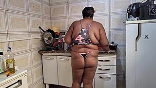 Stepmom takes huge cumshot on face in kitchen.