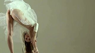 Blonde gymnast shows off acrobatic moves in the gym